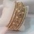 Gold-Tone Imitation Pearl and Crystal Bangle Bracelet